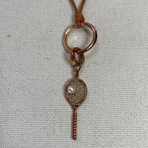 Cute Fossil tennis racket and pearl bead necklace